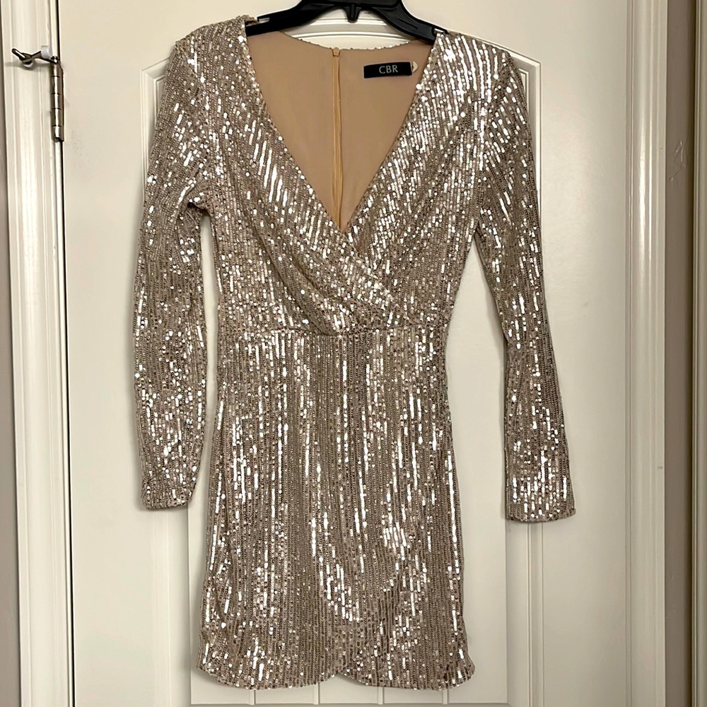 Long sleeve, champagne gold bodycon dress with v neck.